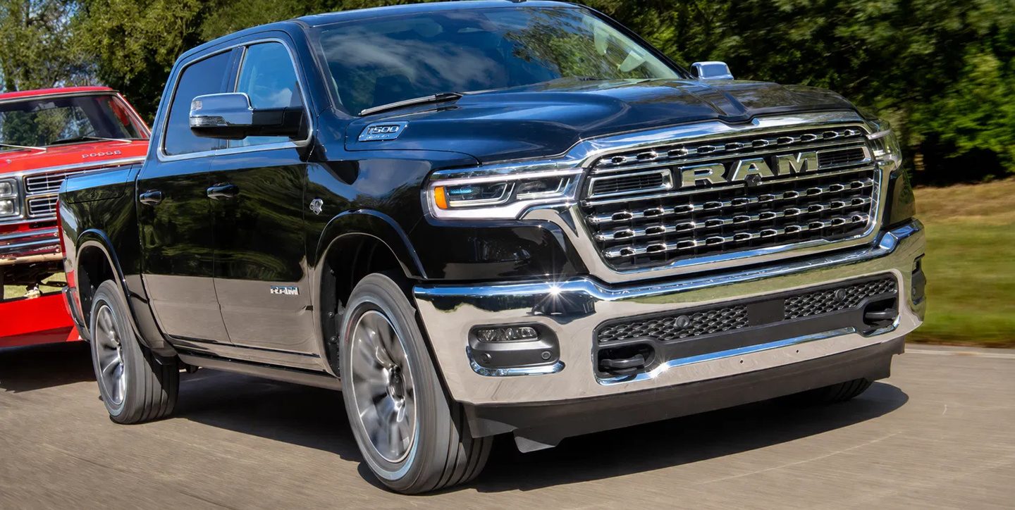 A 2026 Ram 1500 being driven on a country road.