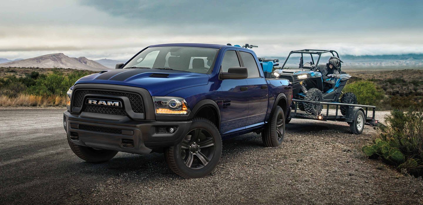 The 2022 Ram 1500 Classic towing a horse trailer.