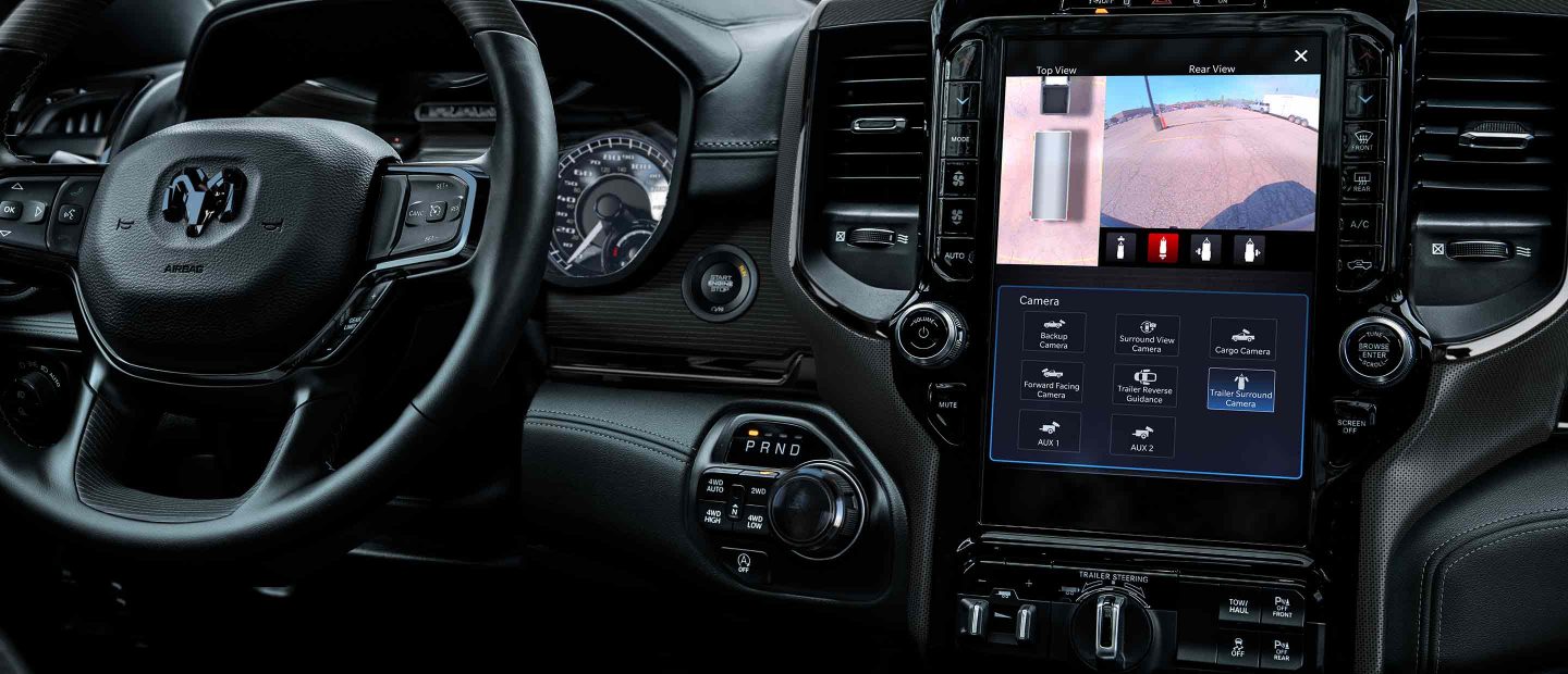The touchscreen in the 2022 Ram 1500 with Trailer Surround Camera selected, displaying the top view and rear view of the trailer.