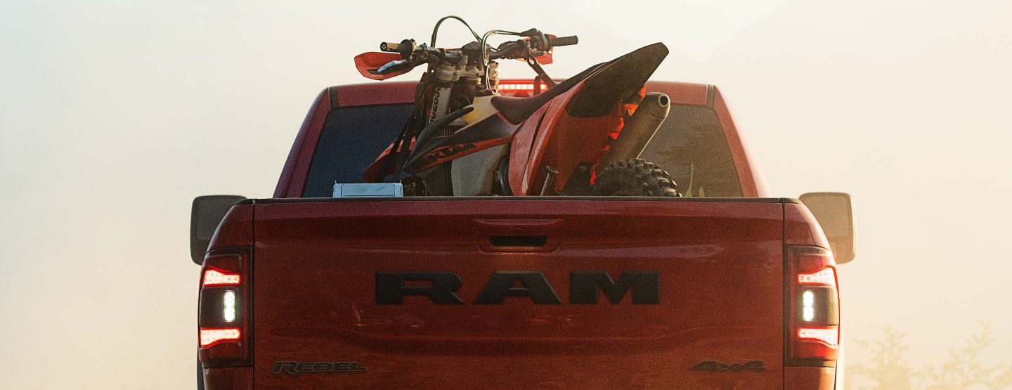 The pickup bed on the 2023 Ram 2500 Rebel with an ATV inside.