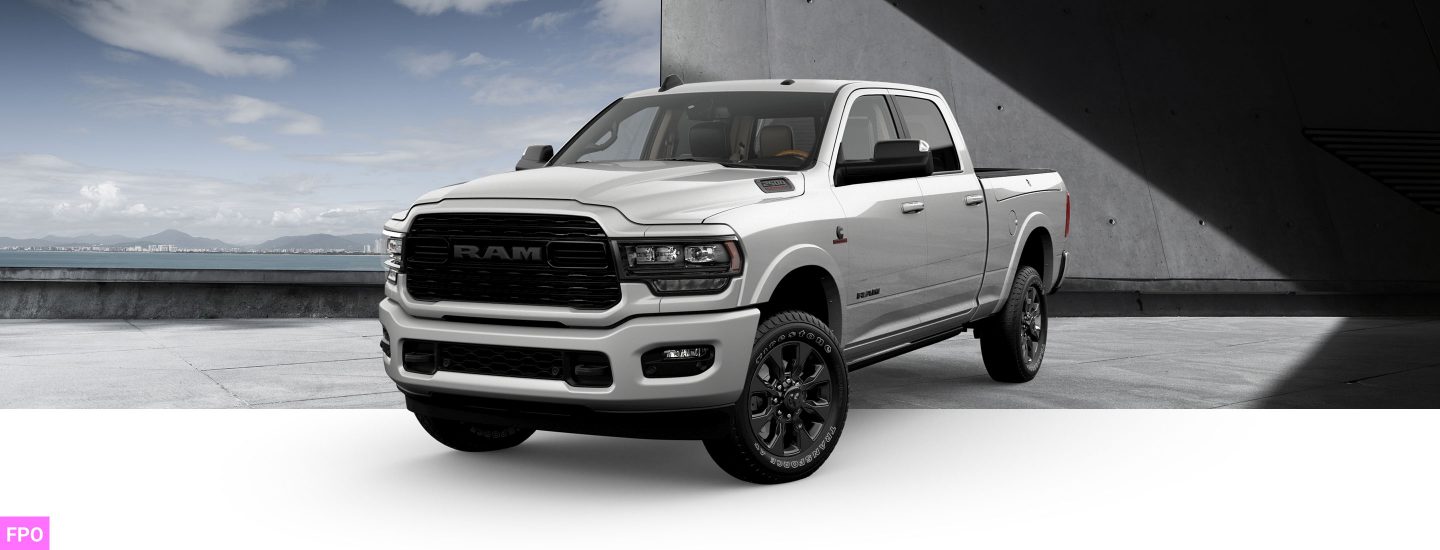 A front angle of a white 2023 Ram 2500 Limited Night Edition Crew Cab.
