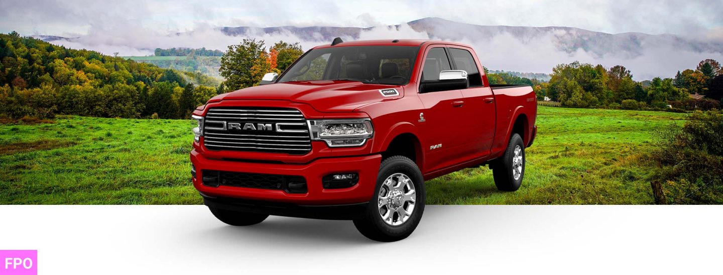 A front angle of a red 2023 Ram 2500 Laramie Crew Cab with the Sport Appearance Package.