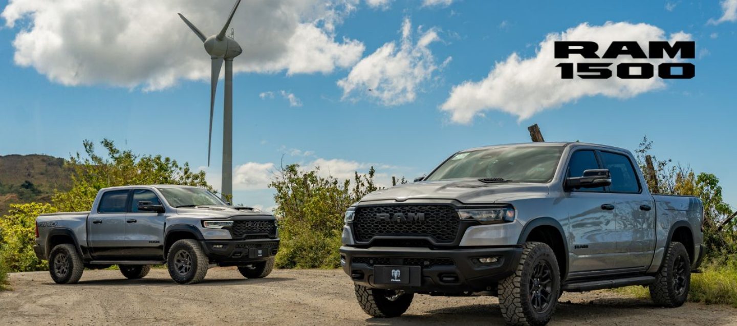 A black 2025 Ram 1500 Laramie 4x4 Crew Cab parked on a clearing in the desert at dusk. It's Ram season.