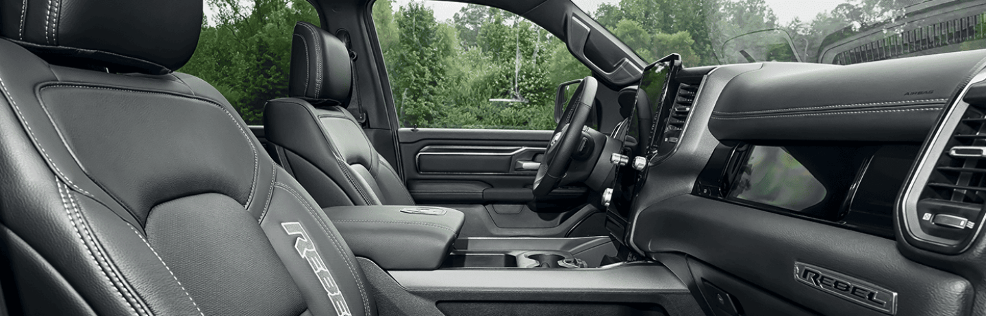 The interior of the 2023 Ram 1500 with the large Uconnect touchscreen displaying a navigation map.