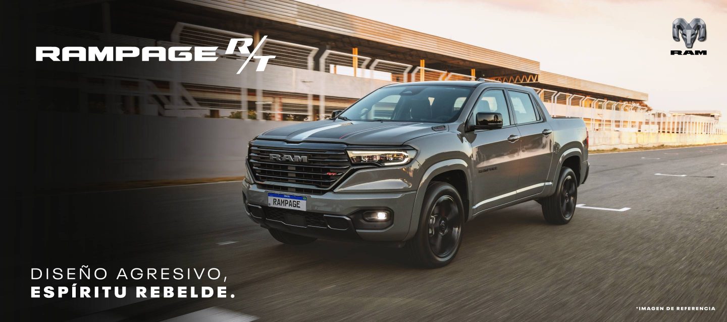A black 2023 Ram 1500 Laramie 4x4 Crew Cab parked on a clearing in the desert at dusk. It's Ram season.